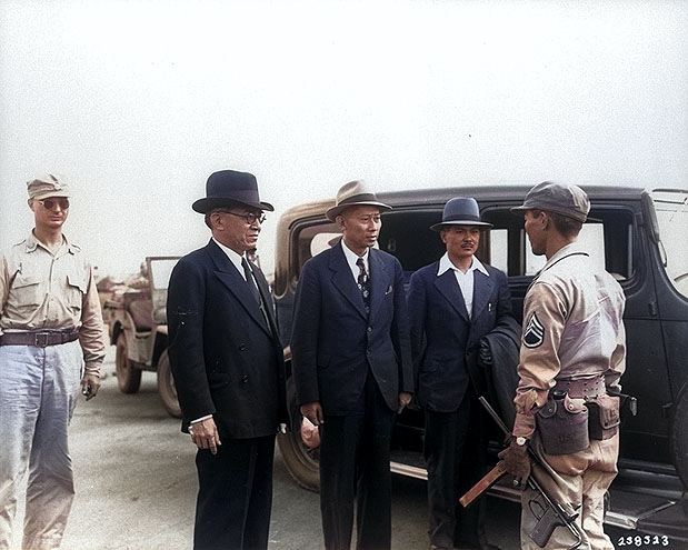 José Laurel being questioned by US Army non-commissioned officer of Filipino ethnicity Staff Sergeant Van Millori at No. 2 Osaka Airport, Osaka, Japan, 15 Sep 1945 [Colorized by WW2DB]