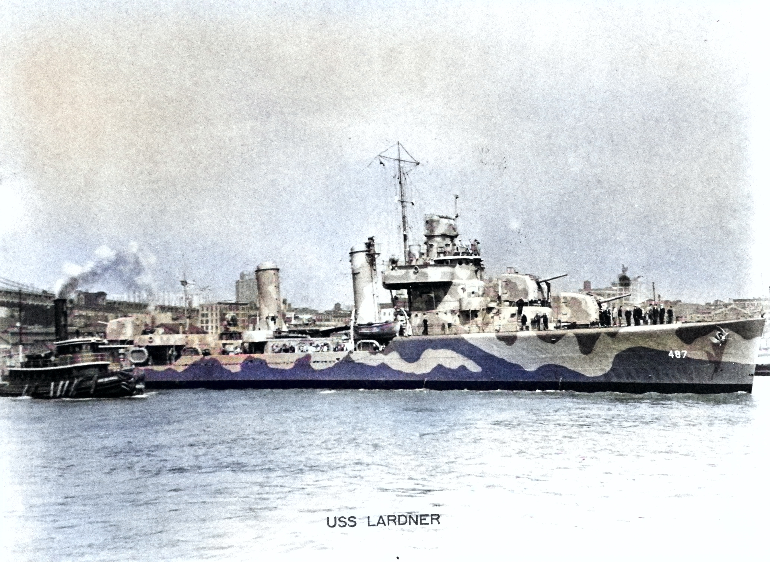 Destroyer USS Lardner, assisted by the tug Captain Seawall, makes her way across New York Harbor, May 1942. Lardner wears Measure 12 (modified) paint scheme. [Colorized by WW2DB]