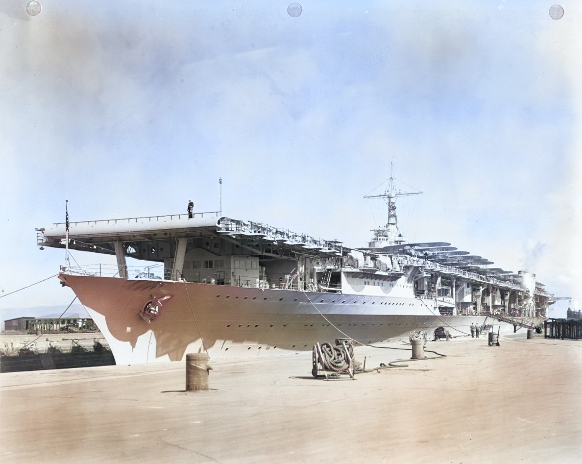 USS Ranger entering drydock at Hunters Point Naval Shipyard, San Francisco, California, United States, 2 Mar 1937. This was the first occasion that a US aircraft carrier entered drydock with aircraft still aboard. [Colorized by WW2DB]