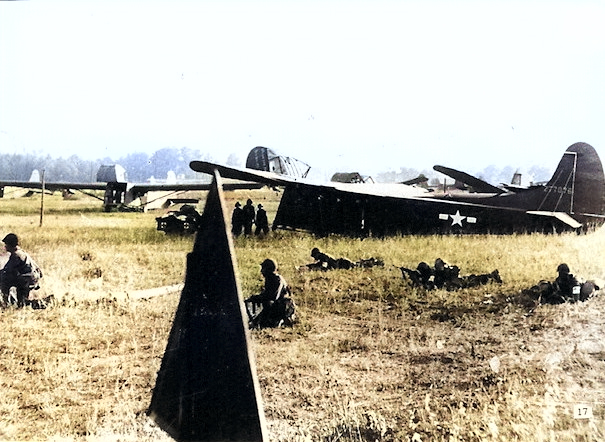 CG-4A gliders on the ground after delivering troops near Wesel, Germany as part of Operation Varsity, 24 Mar 1945. [Colorized by WW2DB]