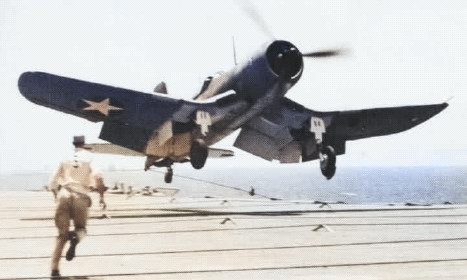 F4U-1 Corsair bouncing up on the flight deck of USS Bunker Hill during an landing attempt, 1943; seen in Feb 1969 issue of US Navy publication Naval Aviation News [Colorized by WW2DB]