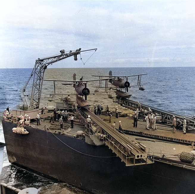 SOC Seagull aircraft on the catapults of a Brooklyn-class light cruiser, somewhere in the Pacific Ocean, Jan 1943 [Colorized by WW2DB]