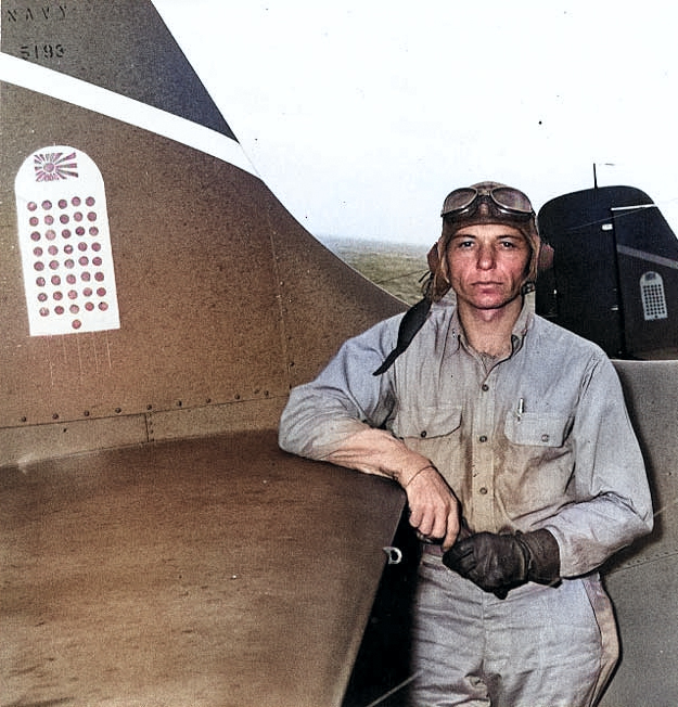 Machinist Donald Runyon posing at the tail of his Wildcat during the Guadalcanal campaign, 10 Sep 1942 [Colorized by WW2DB]