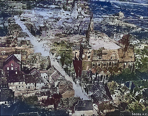 Aerial photograph of a damaged German town during Rhine River area fighting, 24 Mar 1945; taken by crew of B-24 Liberator bomber of 2nd Air Division, US 8th Air Force [Colorized by WW2DB]