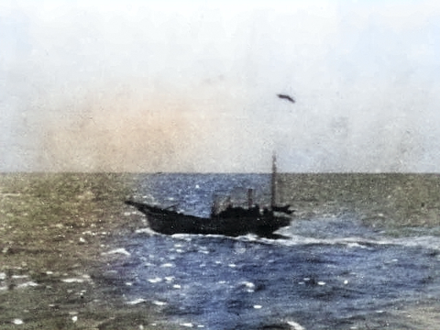 Japanese fishing boat sinking after being attacked by the Doolittle raiders, 18 Apr 1942 [Colorized by WW2DB]