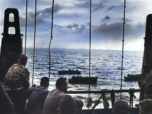 US Marines aboard a US Coast Guard-manned transport while they traveled for Tarawa, Gilbert Islands, Nov 1943 [Colorized by WW2DB]