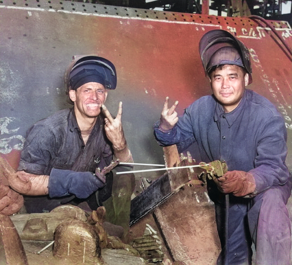 Welders S. L. Ramsey and Benny Chen worked on the Liberty Ship SS Frederick Douglass at the Bethlehem-Fairfield Shipyard, Baltimore, Maryland, United States, 1943 [Colorized by WW2DB]