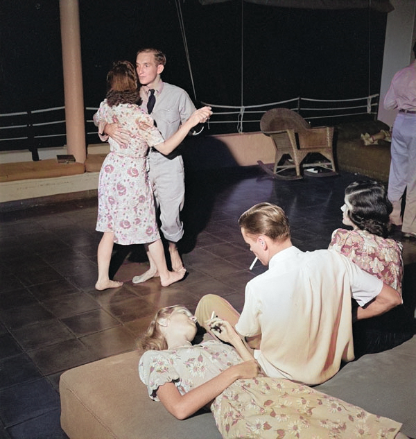 US Navy pilots on leave dancing with their dates at the Chris Holmes Rest Home in Hawaii, Mar 1944 [Colorized by WW2DB]