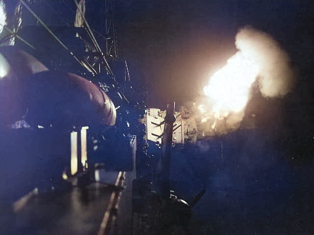 An American warship making a night-time bombardment on Japanese positions ashore on the island of Iwo Jima, Feb 1945 [Colorized by WW2DB]