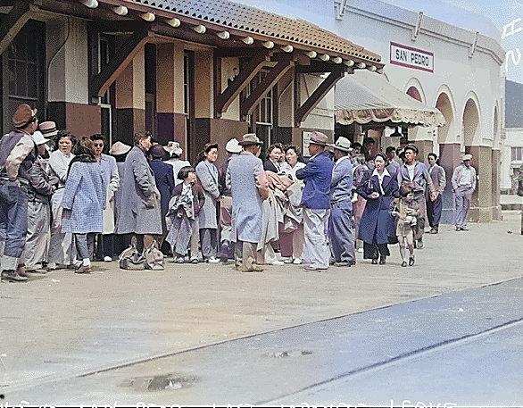 Japanese-Americans waiting for the train which would take them to a relocation center, California, United States, 5 Apr 1942 [Colorized by WW2DB]