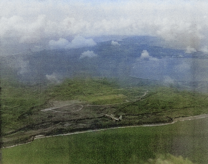 TBF aircraft from USS Coral Sea flying over Aslito Airfield, Saipan, Mariana Islands, 20 Jun 1944 [Colorized by WW2DB]