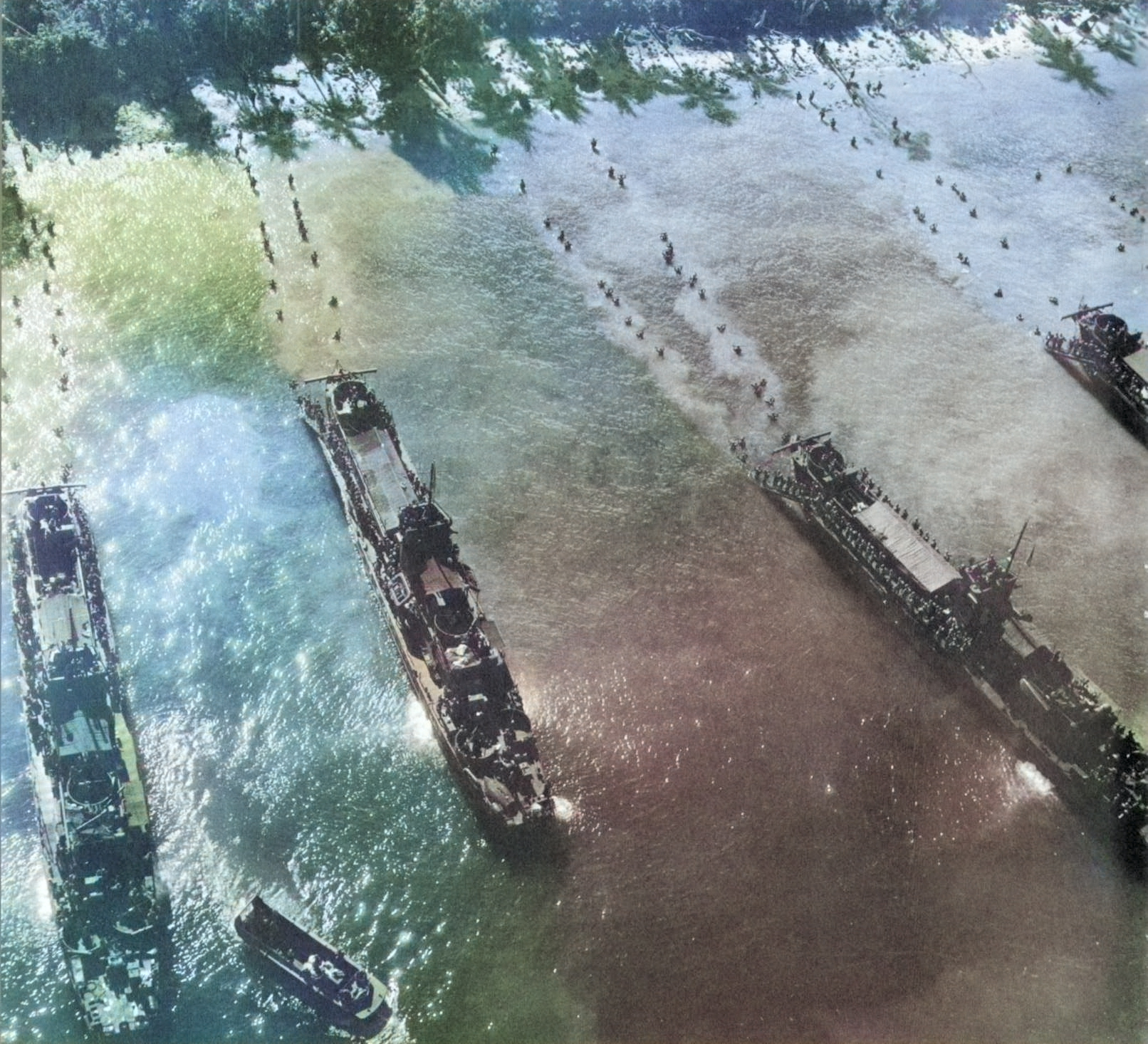 US Navy LCI(L) ships unloading men at Morotai, 15 Sep 1944 [Colorized by WW2DB]