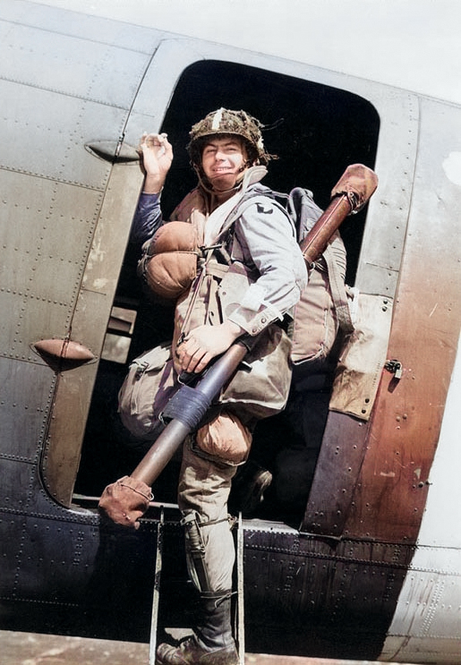 US 101st Airborne Division paratrooper Corporal Louis E. Laird boarded a C-47 transport during dress rehersals for the Normandy invasion, spring 1944 [Colorized by WW2DB]