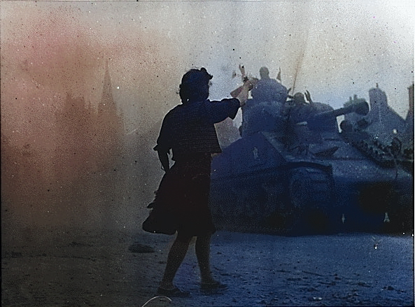 A French woman welcomed American and French troops, Alençon, Basse-Normandie, France, 14 Aug 1944 [Colorized by WW2DB]