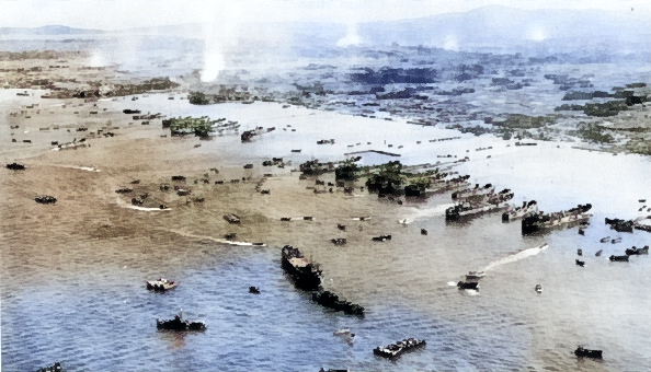 American ships unloading supplies on the beach of Okinawa, Japan, 4 Apr 1945 [Colorized by WW2DB]