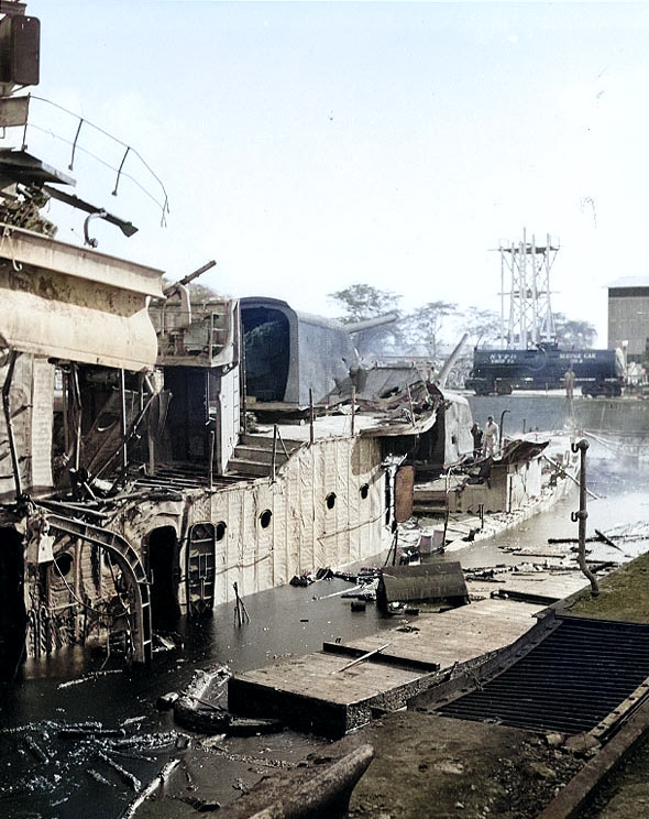 Starboard view of destroyer Downes, burned out and sunk in Pearl Harbor Navy Yard's Drydock Number One, 7 Dec 1941 [Colorized by WW2DB]