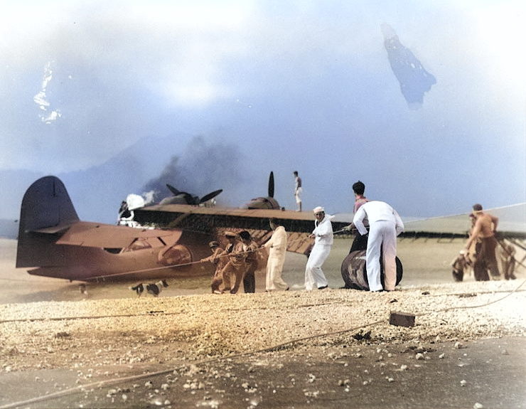 Men attempting to save a burning PBY Catalina aircraft, Naval Air Station Kaneohe, Oahu, US Territory of Hawaii, 7 Dec 1941 [Colorized by WW2DB]