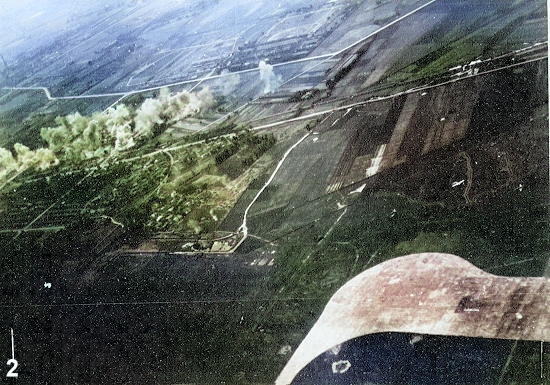 Aircraft of squadron VB-80 from USS Ticonderoga attacking the railroad south of Heito Airfield, southern Taiwan, 9 Jan 1945 [Colorized by WW2DB]