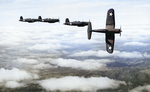 Four F4U Corsair fighters practicing aerial maneuvers, Mar-May 1943; probably stateside training. Photo 2 of 2.