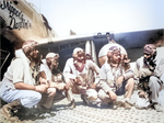 Pilots of the “Tuskegee Airmen,” 332nd Fighter Group in front of P-51C “Skipper’s Darlin’ III” flown by Capt Andrew Turner (2nd from right), at Ramitelli, Italy, 1 Aug 1944. Photo 1 of 2.