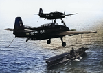 TBM-1C Avengers of VT-2 with wheels and arrester hooks down above the carrier Hornet (Essex-class) after a strike on Guam, 18 Jul 1944. Note rocket rails and ASB radar antennas under the wings.