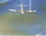 B-17G Fortress of the 15th Air Force flies with No. 4 engine feathered and right wing smoking on a mission to Zwölfaxing, Austria, Jul 8 1944