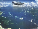 B-24J Liberator “Kansas Cyclone” of the 26th Bomb Squadron approaching targets in and around the Truk Lagoon, Caroline Islands, 1944. Note Udot Island below.