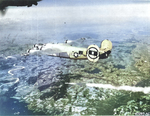 B-24M Liberator, pathfinder aircraft for the 707th Bomb Squadron, drops a smoke marker as well as its bomb load on the rail junction at Mühldorf, Germany, Apr 20 1945 (Hitler’s birthday).