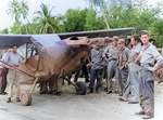 L-5 Sentinel “Bouncing Betsy II” of the 25th Liaison Squadron in New Guinea. Sgt pilots of the “Guinea Short Line” rescued downed fliers and guided fighters to concealed jungle targets. SSGT Jim Nichols standing by the pilot’s door