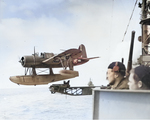 US Navy Lt Fred Hunter piloting an OS2U-3 Kingfisher of Cruiser Scouting Squadron 1 as it is catapulted off the cruiser USS Detroit in the Aleutians, 1943-44