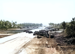 US Navy F6F-3 Hellcats and USAAF B-25 Mitchell bombers of the 41st Bomb Group share the Mullinix airstrip on Tarawa Island, Gilbert Islands, Jan-Apr 1944.