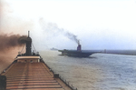 Newly converted USS Sable training aircraft carrier on her delivery trip to Chicago, Illinois upbound on Lake St Clair, Michigan, United States.  Photo taken from the freighter Joseph Wood. May 24 1943.