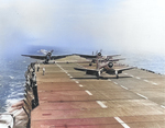 F4U-1 Corsair, an F4F Wildcat, and two TBF-1 Avengers run up their engines prior to launch from the training aircraft carrier USS Sable on Lake Michigan, United States, mid-1943.