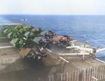 One SNJ Texan and 13 FM-2 Wildcats tied down on the flight deck of training aircraft carrier USS Sable on Lake Michigan, United States, 1944.