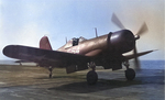 An F4U Corsair running up its engine before taking off from the training aircraft carrier USS Sable on Lake Michigan, United States, 1944-45.