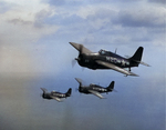 Three FM-2 Wildcats flying over Lake Michigan, United States during carrier qualifications aboard the training aircraft carrier USS Sable, 1943-44.