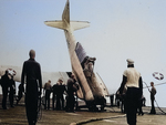 An SNJ-3C Texan noses over aboard the training aircraft carrier USS Wolverine on Lake Michigan, United States, 1943.