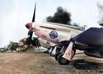 P-51 Mustangs of the 45th Fighter Squadron lined up on South Field, Iwo Jima, Mar 7, 1945. Fire is from a P-51 from the 78th Fighter Squadron that crashed on landing and struck two parked 45th Fighter Squadron P-51s.