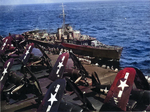 Australian Destroyer HMAS Nizam alongside carrier USS Shangri-La for refueling, April 1945. Note Corsairs of Air Group 85 spotted on the flight deck.