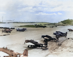 Navy TBF-1 Avengers at the Munda Airstrip, New Georgia, Solomons, Sep 1943. Note the crews are in the process of applying the newly updated National Insignia with white bars and a blue border.