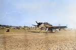 TBM-3 Avenger of Marine Squadron VMTB-242 taxiing past USAAF P-51D Mustangs at Iwo Jima