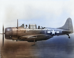 SBD-6 Dauntless scout bomber of Marine Squadron VMSB-231 in flight over the Pacific, 1944. Note the ASB Radar antenna under the wing.