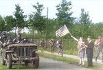 Members of the 327th Glider Infantry Regiment, 101st Airborne, driving from Eindhoven to Nijmegen, Netherlands as part of Operation Market Garden are cheered by Dutch citizens, about Sep 18, 1944.