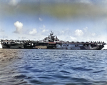 Broadside view of the port side of the USS Hornet (Essex-class) at anchor showing her Dazzle MS33/3a paint scheme, 1944, probably at Ulithi.