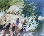 Burmese and Chinese laborers using basic hand tools to create the Burma Road out of thick forests on steep hillsides and swampy flatlands, 1937