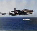 A training flight of TBF-1 Avengers lining up to drop practice torpedoes, late 1942, off the east coast of the United States. Photo 1 of 4.