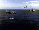 A training flight of TBF-1 Avengers lining up to drop practice torpedoes, late 1942, off the east coast of the United States. Photo 3 of 4.