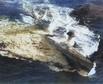 Type IXC/40 U-Boat U-185 foundering in the mid-Atlantic after an aerial depth charge attack by a TBF-1 Avenger from Escort Carrier USS Core, 24 Aug 1943. 36 were rescued while 43 perished.