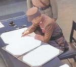 Xu Yongchang signing the surrender document on behalf of China aboard USS Missouri, Tokyo Bay, Japan, 2 Sep 1945, photo 5 of 5