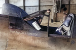 Close up of the cockpit and canopy of the P-40K Warhawk assigned to Capt Jack Hamilton of the 26th Fighter Squadron at Dijan Airstrip, Assam, India, late 1942.